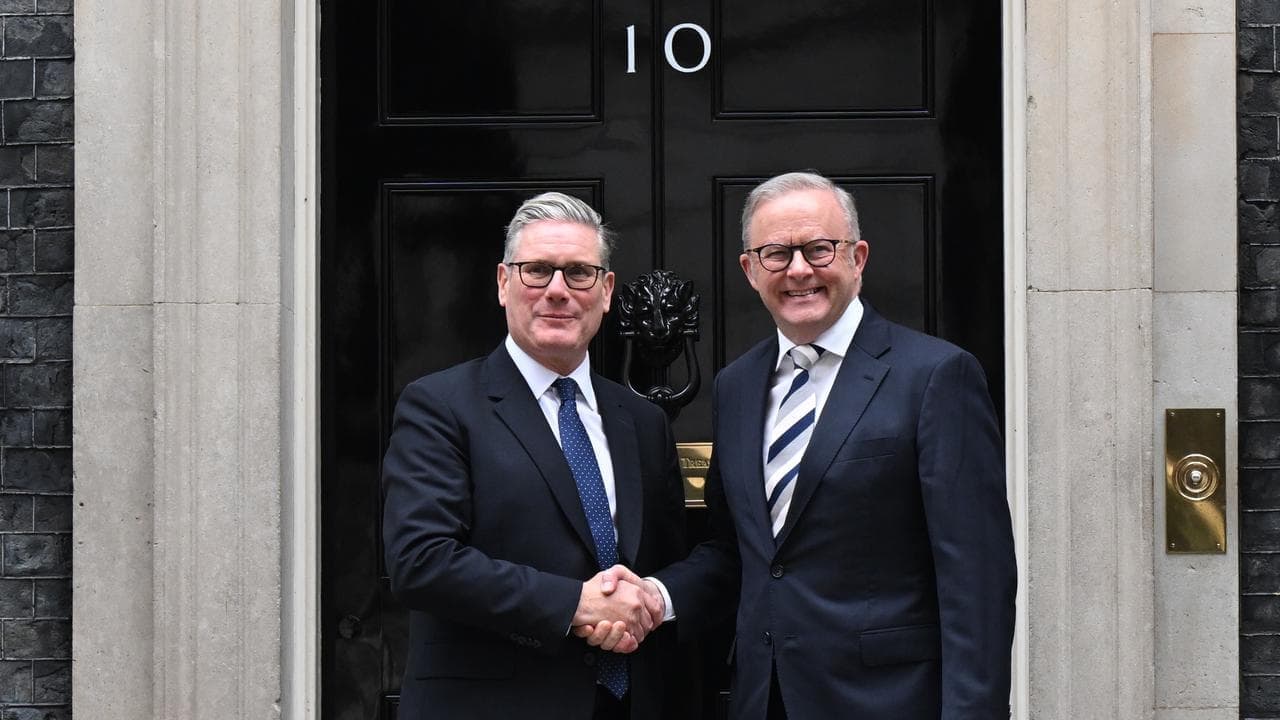 PM all smiles on subs pact after Downing Street chat
