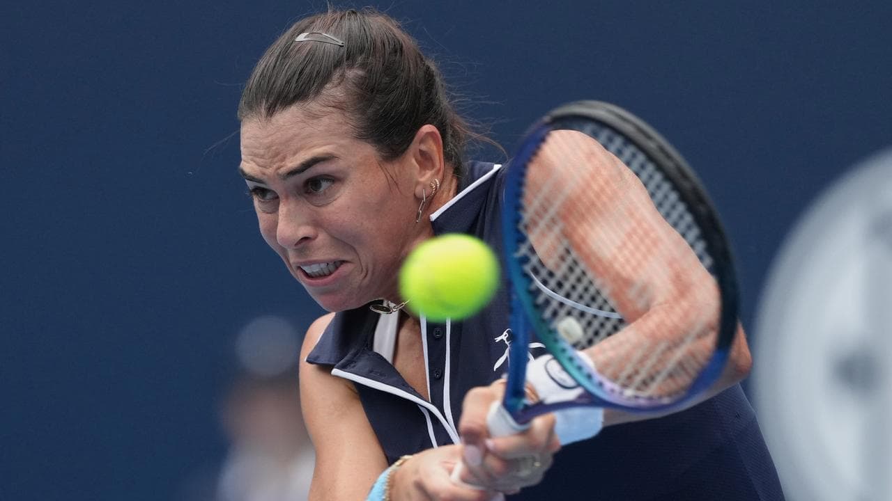 Tomljanovic battles back to knock out seed Tauson