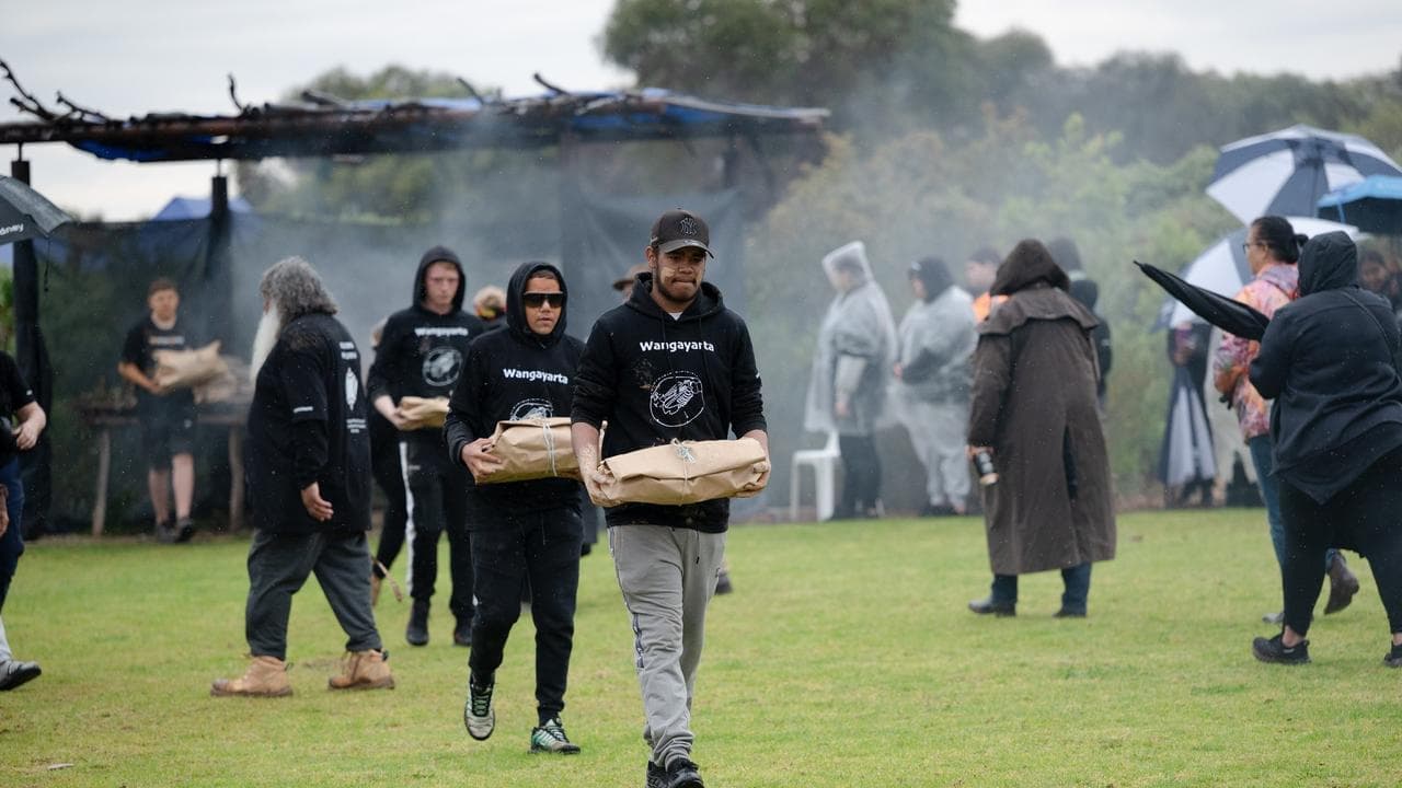 Community healing together as ancestors reburied