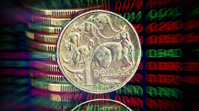 Australian shares trim losses as miners play catch-up