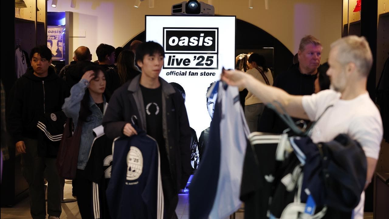 Mega fans line up for merch as Oasis countdown begins