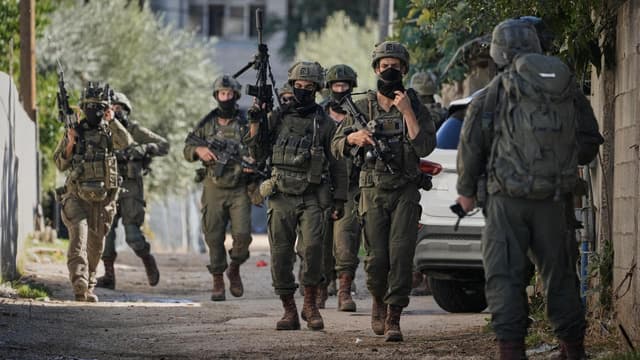 Pair shot after appearing to surrender in West Bank