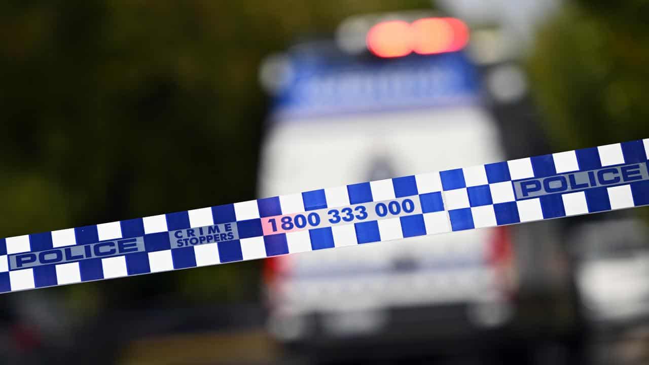 Man shot dead while sitting in car in suburban Sydney