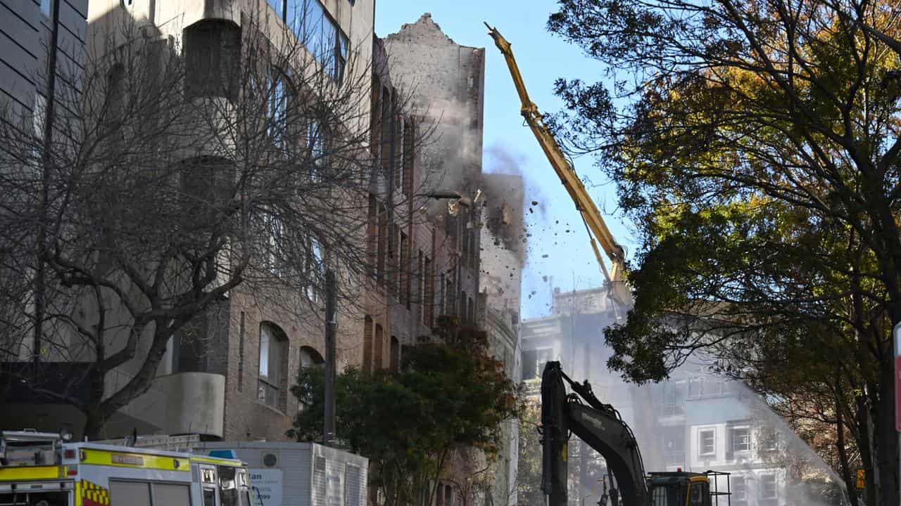 Body search delayed by demolition of city fire building