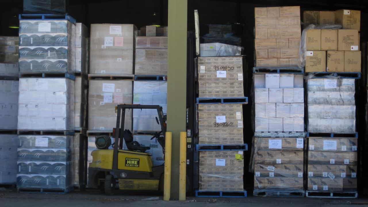 Woolworths worker dies after pallet stack collapses