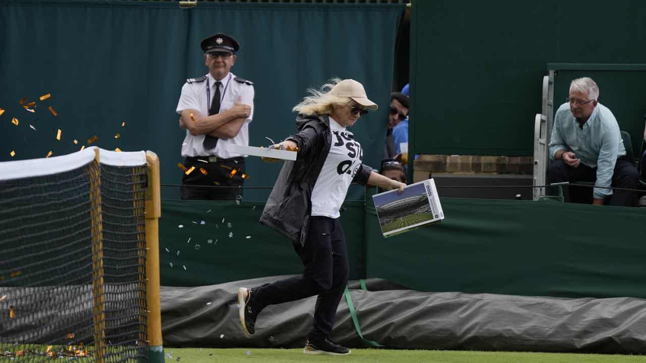 Aussie Saville's match at Wimbledon hit by protester