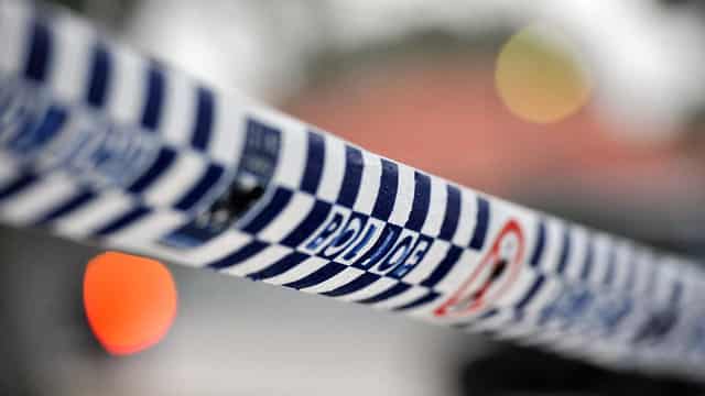 Man critical as homicide detectives probe woman's death