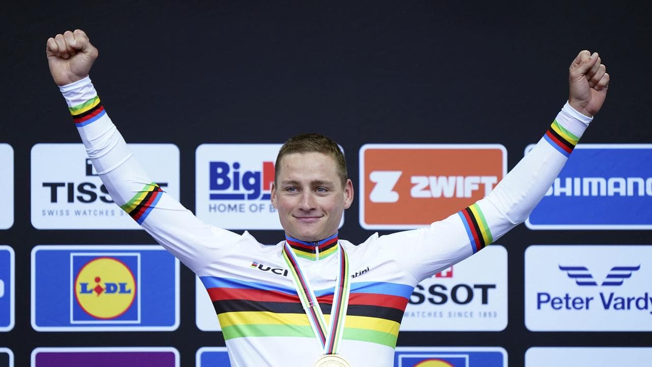 Van der Poel rises from crash to win world road race