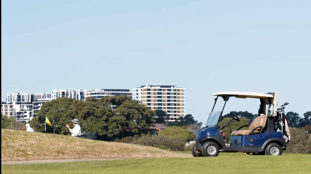 Police divers retrieve body from exclusive golf club