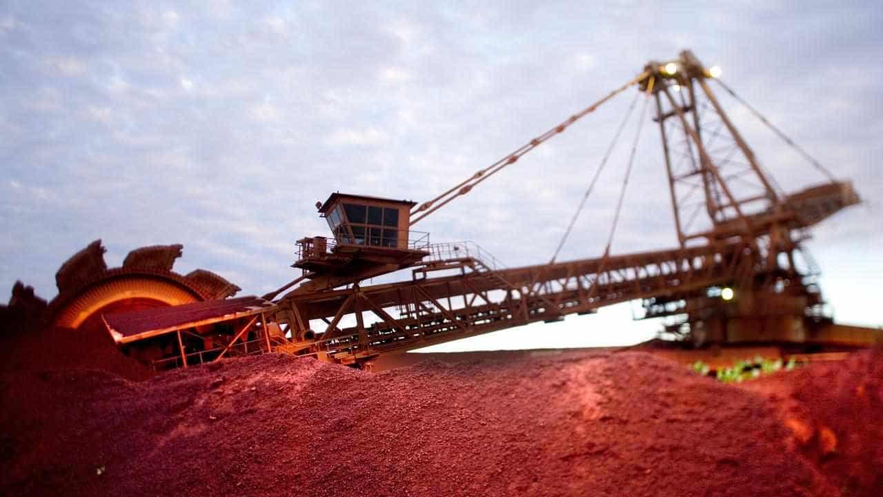 BHP warns on tax, productivity after plunge in profits