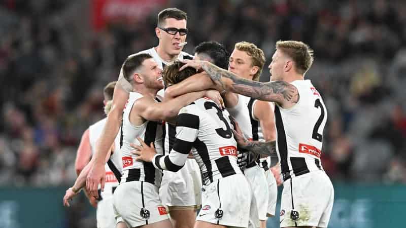 Magpies massacre Bombers to seal AFL minor premiership