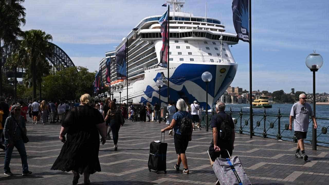 Cruise passengers wave goodbye to COVID restrictions