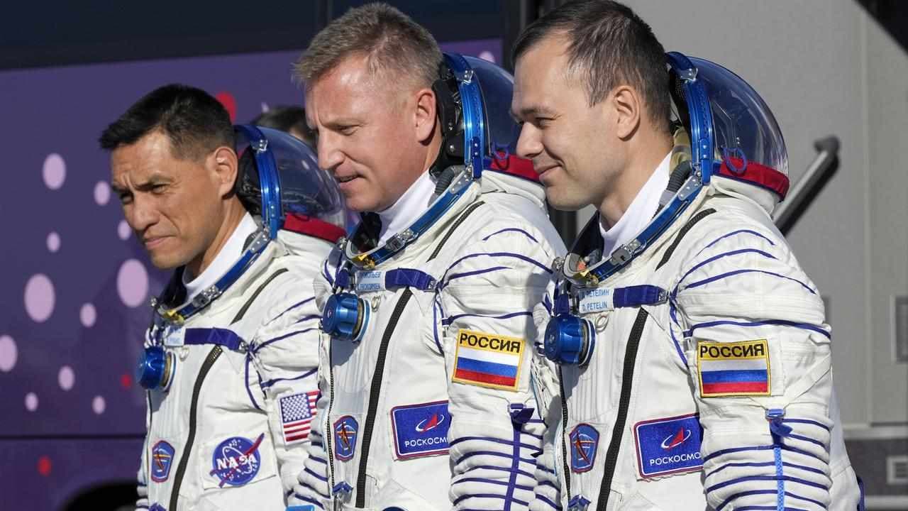 Three astronauts return to earth after a year in space