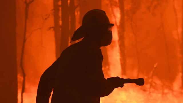 Residents return after dangerous blaze threatened homes