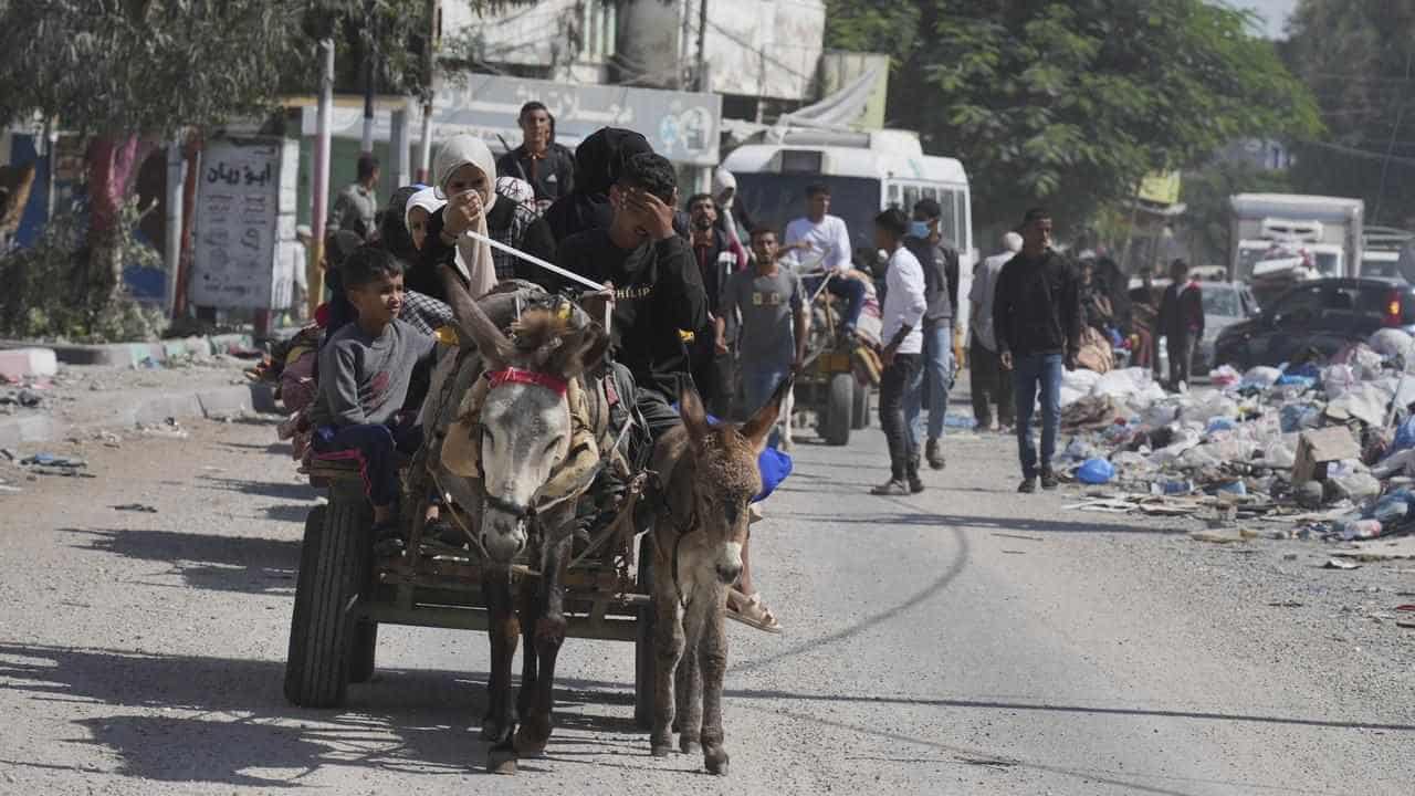 Civilians flee Gaza City as Israel masses tanks, troops