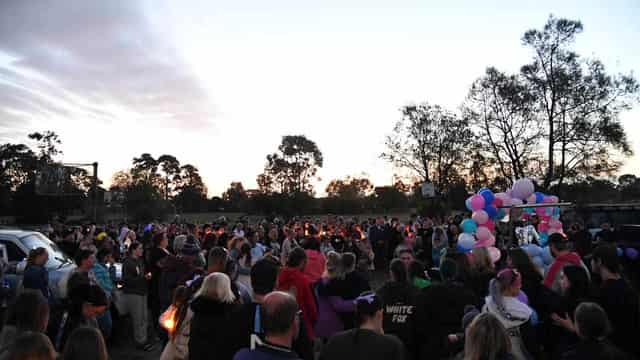 Community vigil for siblings who died in shed fire