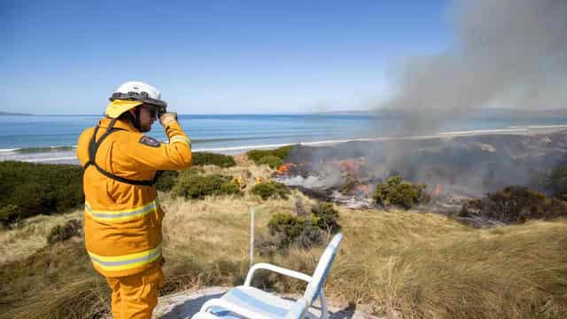 Weather helps firefighters tame destructive blaze