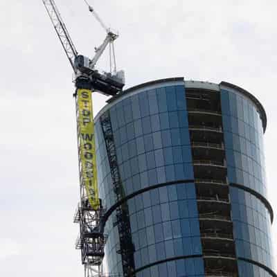 Climate activists scale 140-metre crane at Woodside HQ