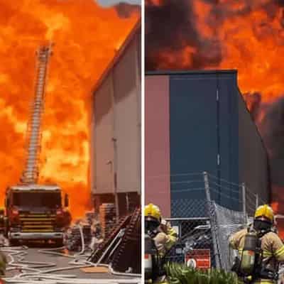 Police pull body from paint factory after massive blaze