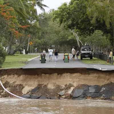 Heroic flood rescues as town evacuation postponed