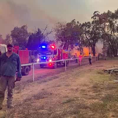 Buildings destroyed in big blaze as rain brings relief