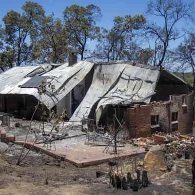 Third home lost in bushfire, residents return to ruins