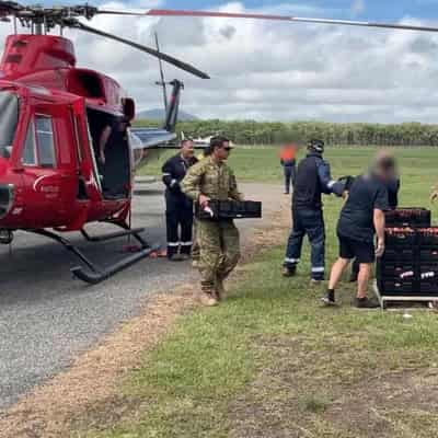 Hopes fade for missing man as flood bears down on town