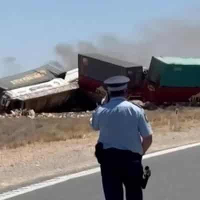 Driver charged over two killed in truck and train crash