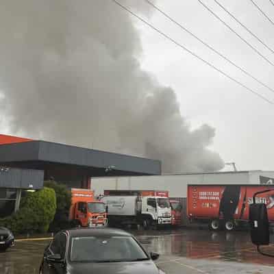 Recycling factory fire sends black smoke billowing