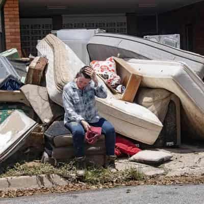 Storm clouds loom for economy as rain, floods take toll