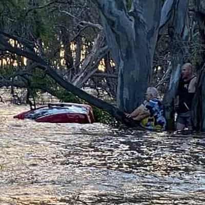 Floods swamp towns as kayaker found safe and well