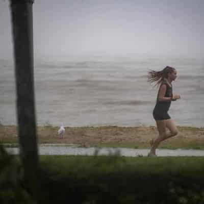 Desperate boat rescue as monsoon drenches north Qld