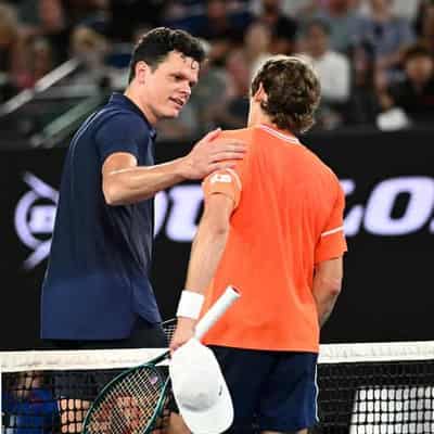 De Minaur advances in Open after Raonic retires