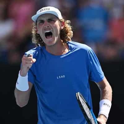 Purcell, Kokkinakis dig deep to reach Open second round