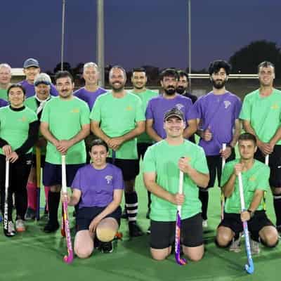 Yezidi refugees have a field day picking up hockey