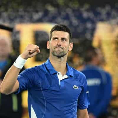 Djokovic finds Melbourne Park mojo in milestone match