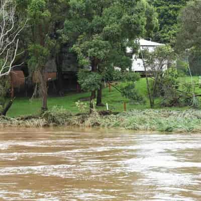 More rain forecast after town flooded, roads cut