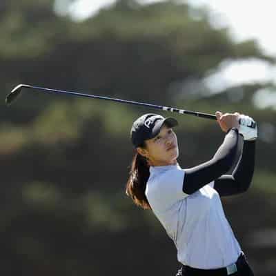 Malaysian golfer Ashley Lau salutes at the Vic Open