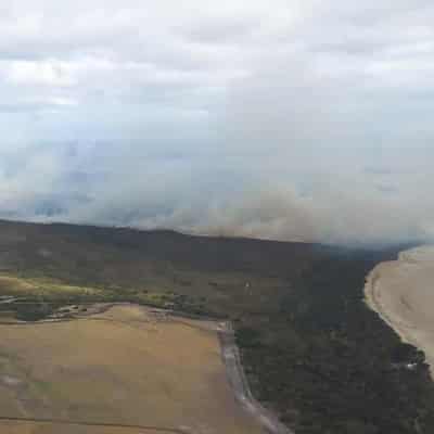 Bushfire downgraded after campers, residents evacuated