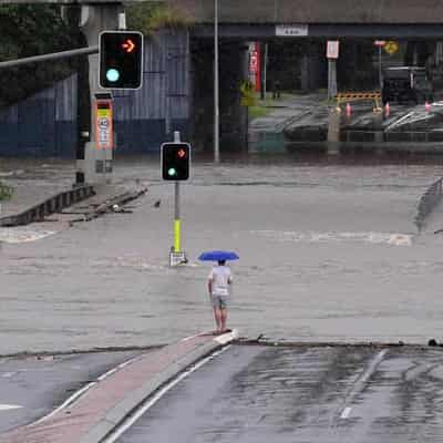 Heavy rain causes floods as tropical cyclone looms