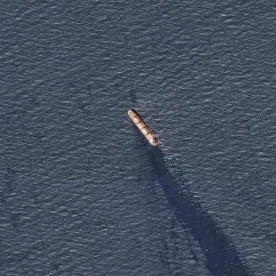 Houthis order shipping ban, missiles hit ship off Yemen