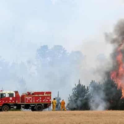 Battle rages on as fire destroys at least one home