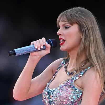 Taylor Swift sings up a storm in rain hit Sydney show