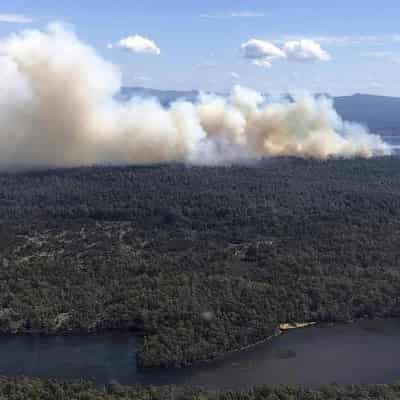 Firefighters battle to control three remote bushfires