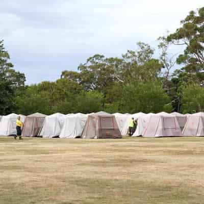 Tent town springs up as help arrives for fire fight