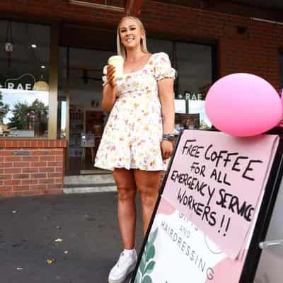 Haircuts, coffee: life goes on in bushfire danger zone