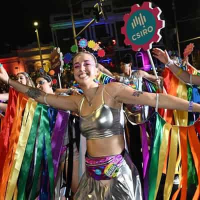 Mardi Gras parade sparkles through sorrow and tension