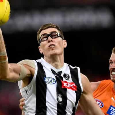 Magpies' Cox reprimanded by AFL for pushing Mumford