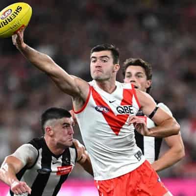 Magpies still winless as slick Swans end MCG hoodoo