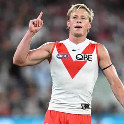 Longmire heaps praise on versatile Swans star Heeney